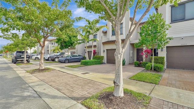 townhome / multi-family property featuring a garage