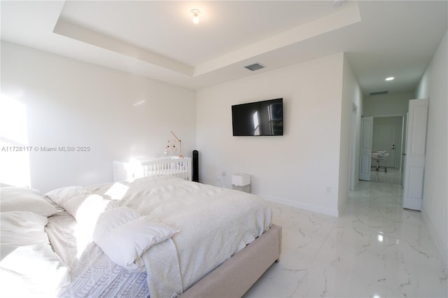 bedroom featuring a tray ceiling