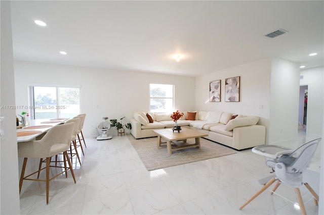 living room featuring plenty of natural light