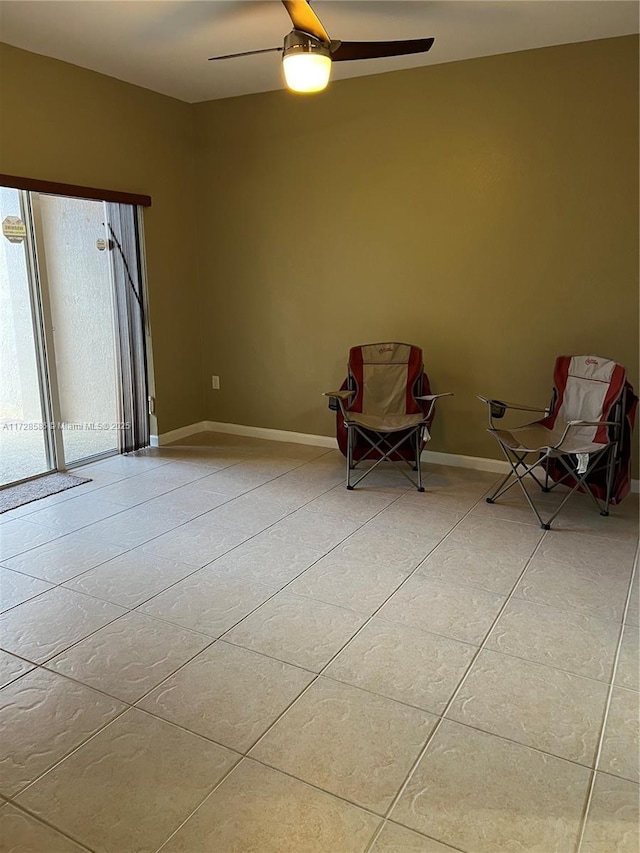 unfurnished room featuring ceiling fan and light tile patterned flooring