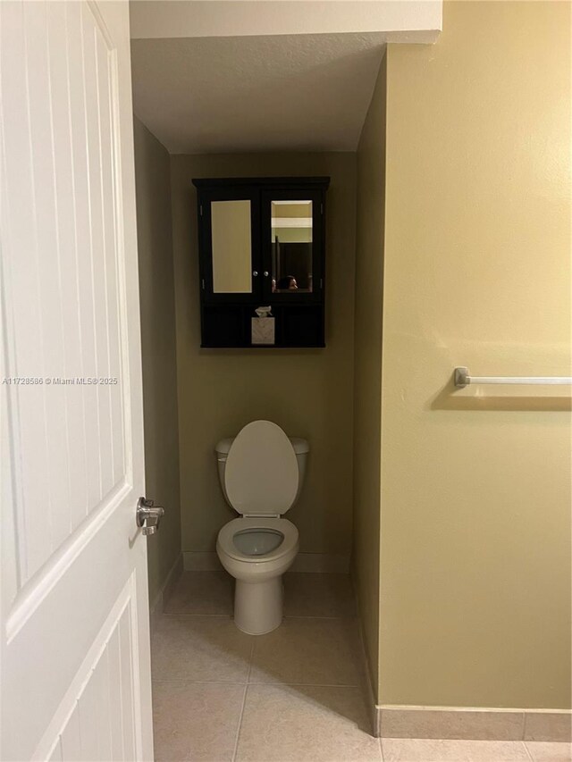 bathroom with tile patterned floors