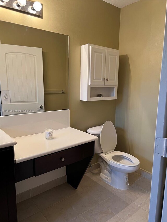 bathroom featuring vanity, a shower with door, and a wealth of natural light