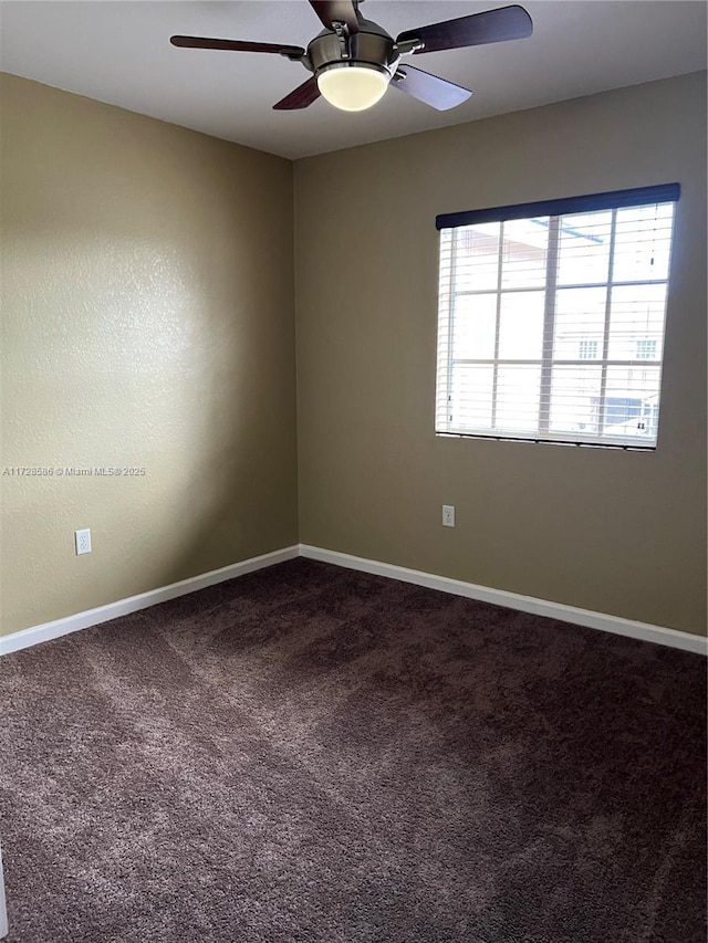 unfurnished room featuring ceiling fan and carpet flooring