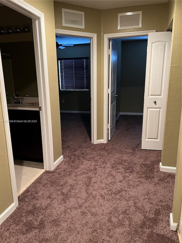 hall featuring carpet floors