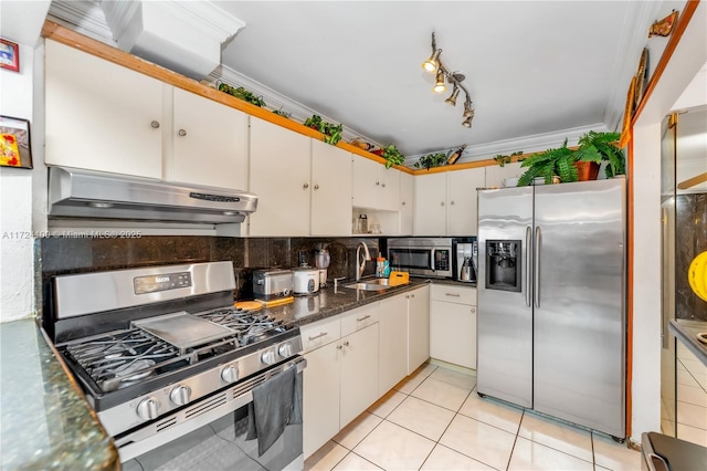 kitchen with sink, light tile patterned flooring, crown molding, white cabinetry, and appliances with stainless steel finishes