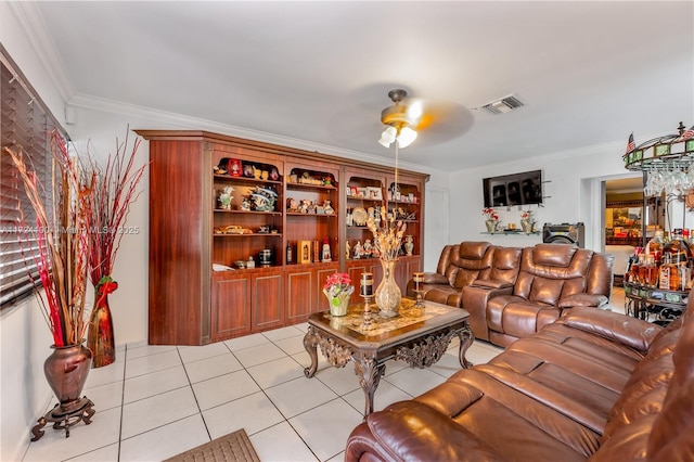 tiled living room featuring ceiling fan and ornamental molding