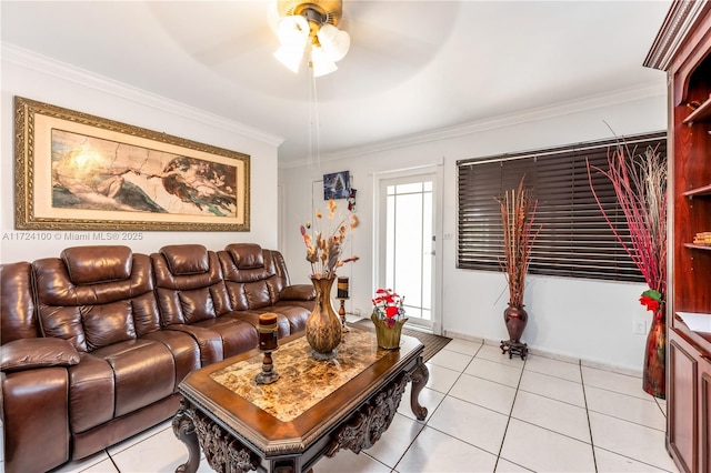 tiled living room with ceiling fan and crown molding