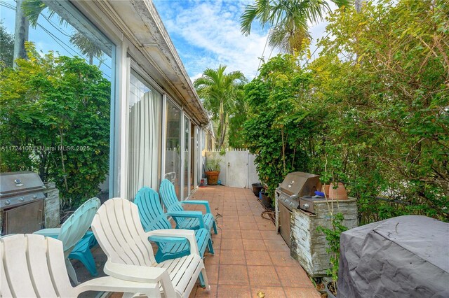 view of patio featuring grilling area and exterior kitchen