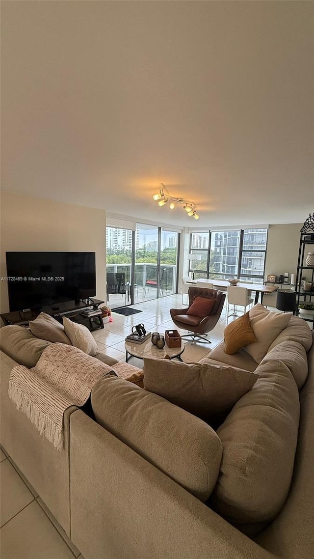 living room with a healthy amount of sunlight and tile patterned floors