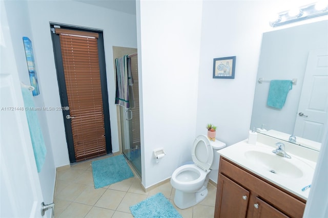 bathroom with walk in shower, tile patterned floors, toilet, and vanity