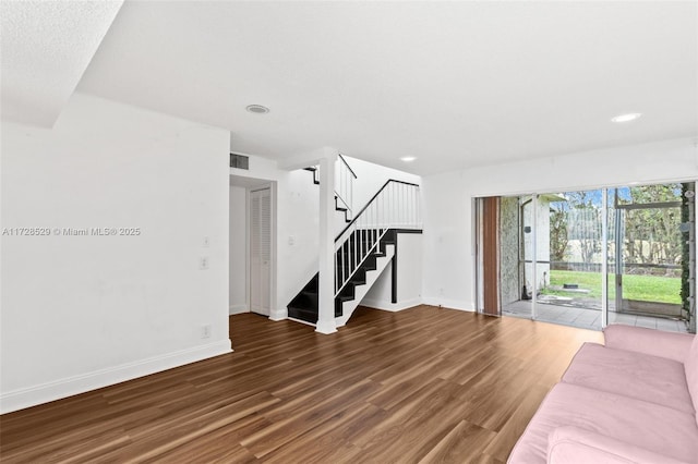 unfurnished living room with hardwood / wood-style floors