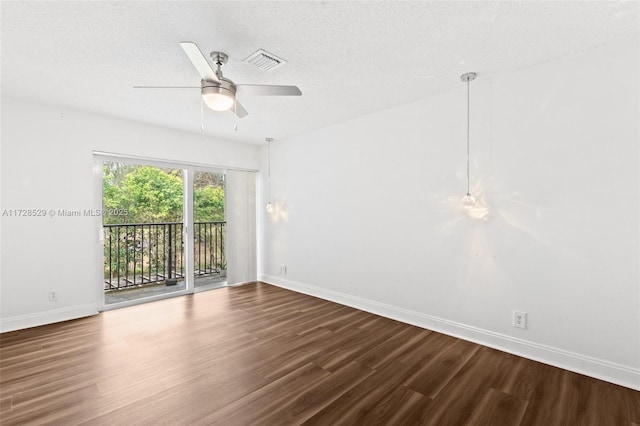 unfurnished room with ceiling fan, a textured ceiling, and hardwood / wood-style floors