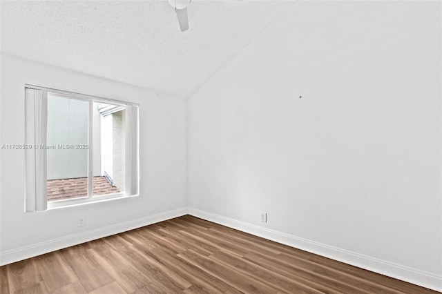 unfurnished room featuring hardwood / wood-style flooring, ceiling fan, a textured ceiling, and plenty of natural light