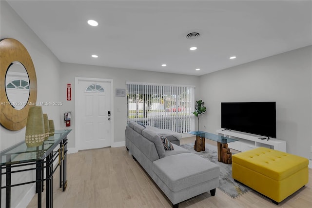 living room with light hardwood / wood-style floors