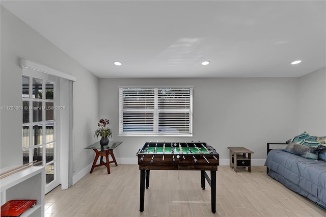 playroom with light hardwood / wood-style floors