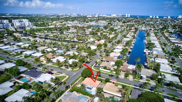 birds eye view of property featuring a water view