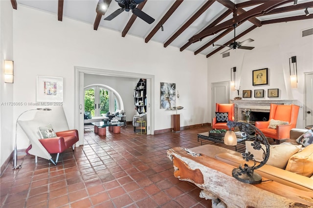 tiled living room featuring high vaulted ceiling, ceiling fan, and beamed ceiling