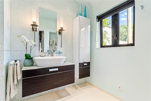 bathroom with vanity, tile walls, and tile patterned floors