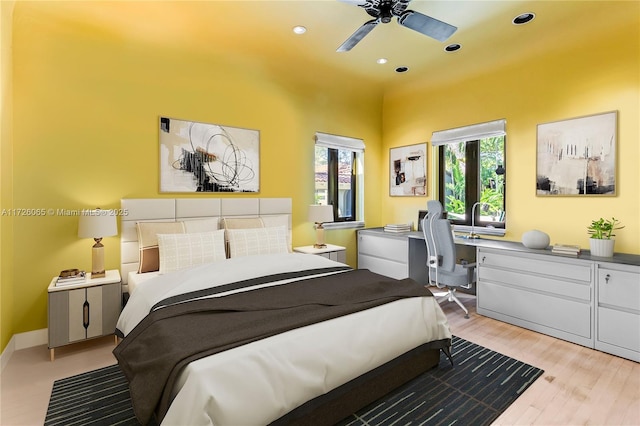 bedroom featuring ceiling fan and light hardwood / wood-style floors