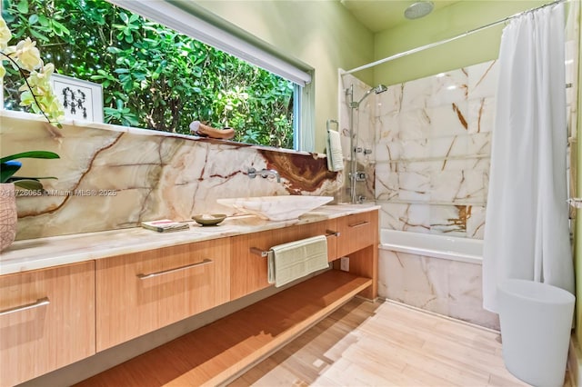 bathroom featuring vanity and shower / tub combo with curtain