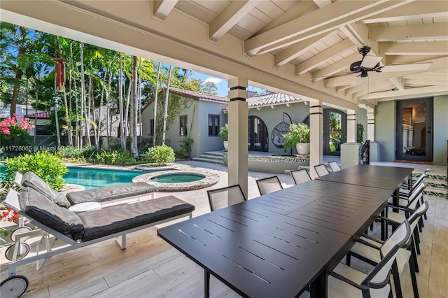 view of patio featuring a pool with hot tub and ceiling fan