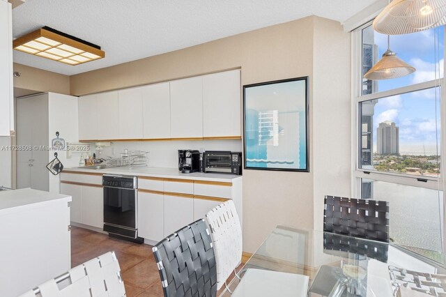 3600 Mystic Pointe Unit 1801, Aventura, FL 33180 - kitchen with white cabinetry, light countertops, tile patterned flooring, black dishwasher, and a sink
