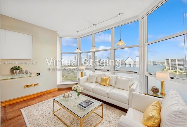 3600 Mystic Pointe Unit 1801, Aventura, FL 33180 - living area featuring wood finished floors and baseboards