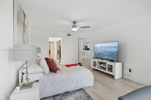 bedroom featuring ceiling fan and hardwood / wood-style flooring