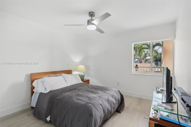 bedroom with ceiling fan and light hardwood / wood-style floors