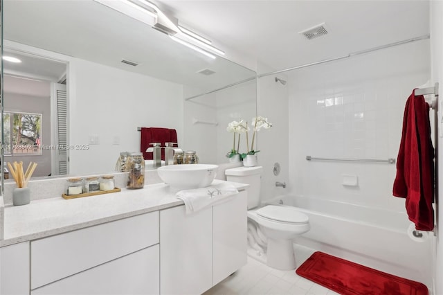 full bathroom with toilet, tiled shower / bath combo, and vanity