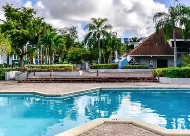 view of pool featuring a patio