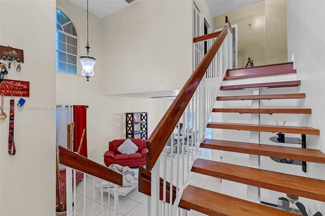 staircase with tile patterned flooring