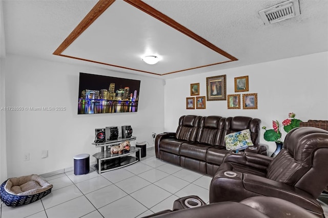 tiled living room featuring a textured ceiling