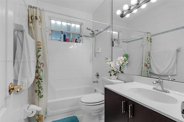 full bathroom featuring toilet, vanity, and shower / tub combo