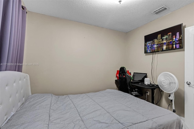 bedroom featuring a textured ceiling