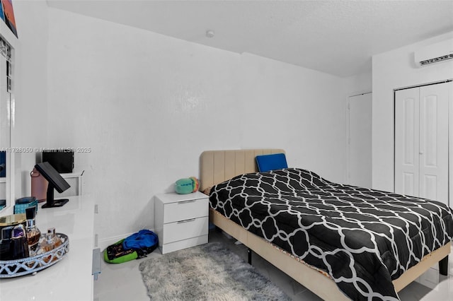 bedroom featuring a wall mounted AC, a closet, and radiator heating unit