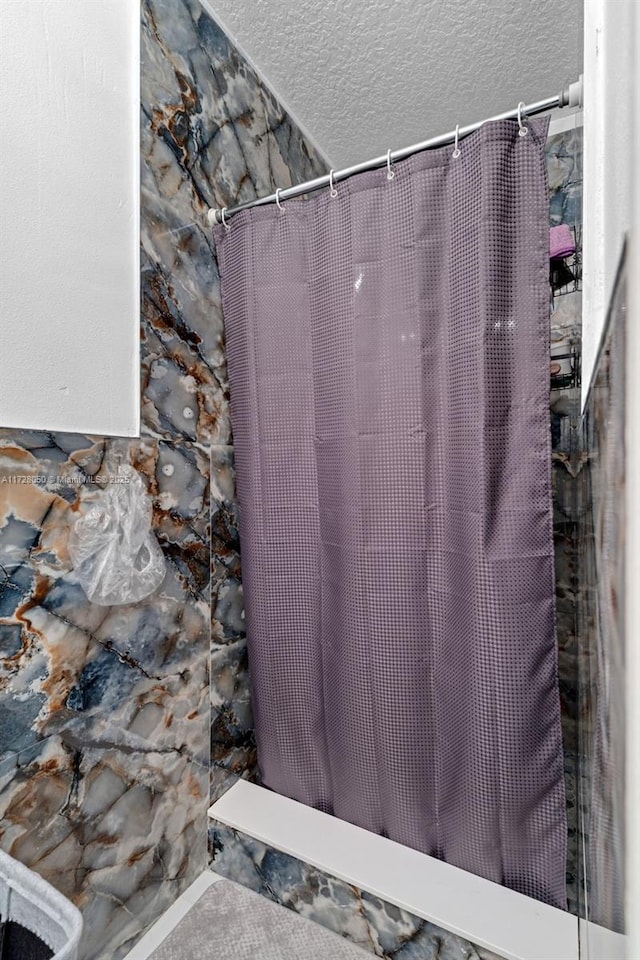 bathroom with a textured ceiling