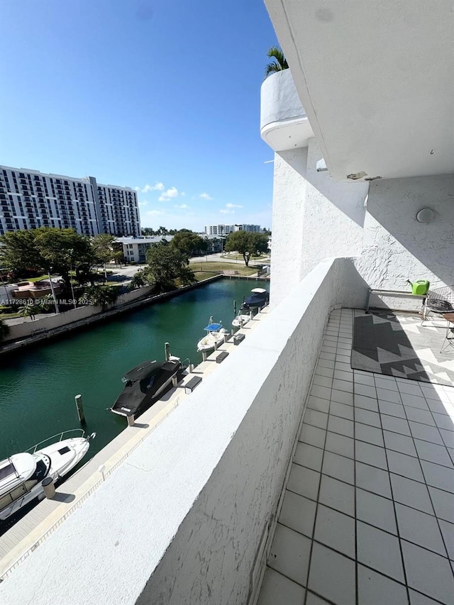 balcony featuring a water view