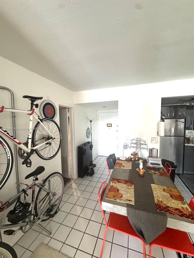 dining space with light tile patterned floors