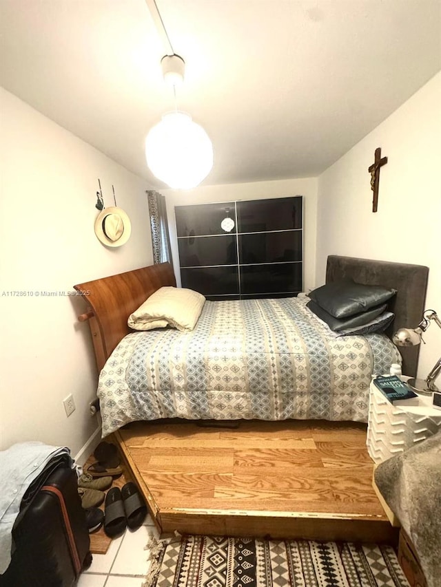 bedroom featuring tile patterned flooring