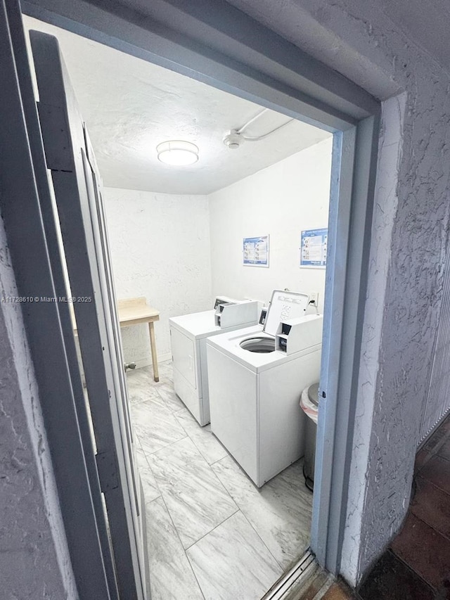 washroom featuring washer and dryer