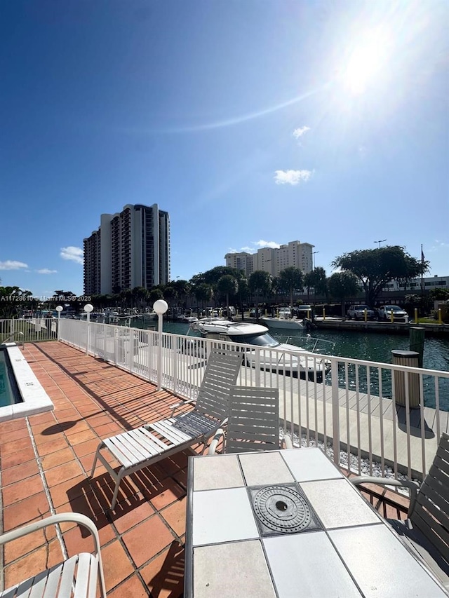 view of patio with a water view