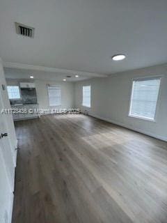 spare room with wood-type flooring