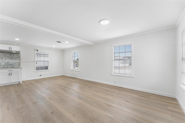interior space featuring baseboards, recessed lighting, light wood finished floors, and crown molding