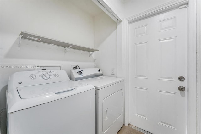 laundry area with washing machine and clothes dryer