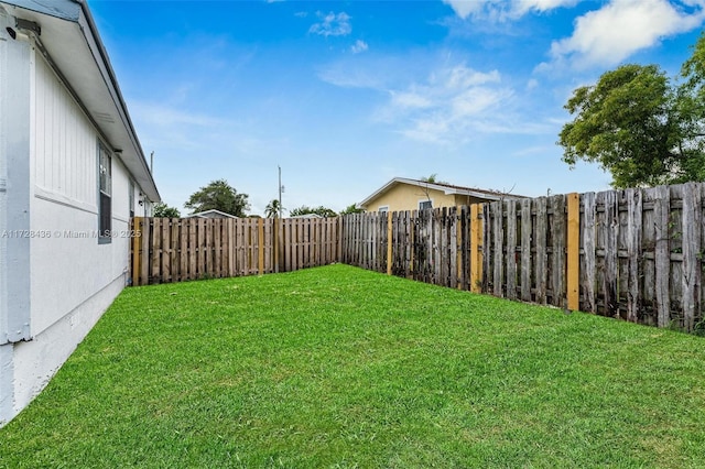view of yard with a fenced backyard