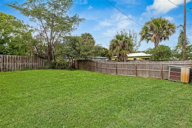 view of yard featuring a fenced backyard