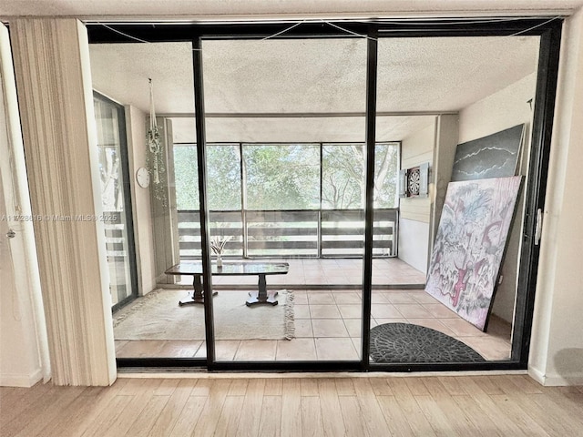 doorway to outside with light hardwood / wood-style floors