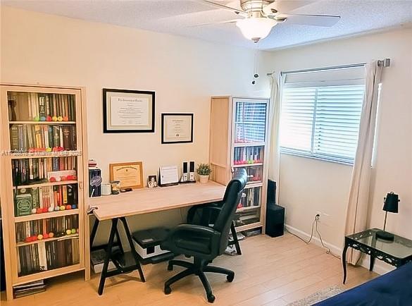 office area featuring ceiling fan and light hardwood / wood-style flooring