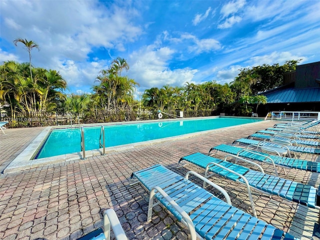 view of swimming pool with a patio area